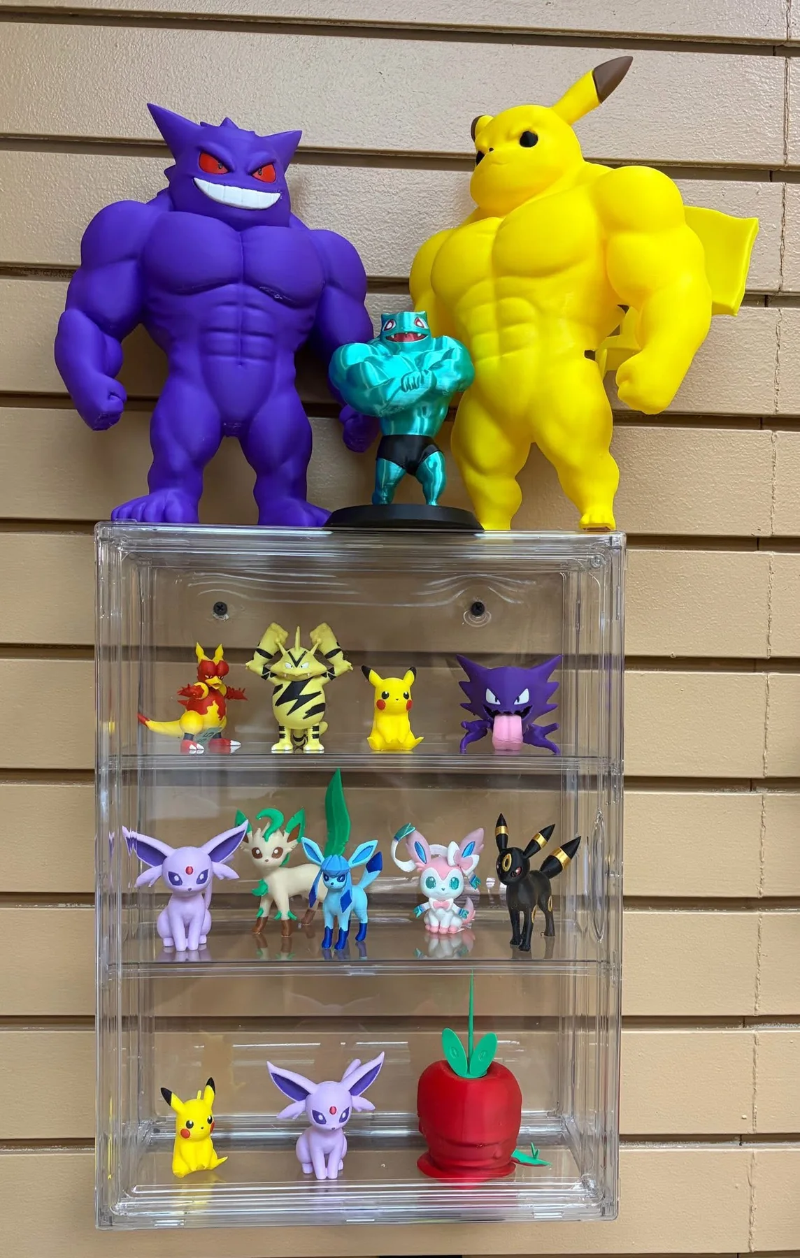 Colorful 3D-printed character figures displayed inside the shop.