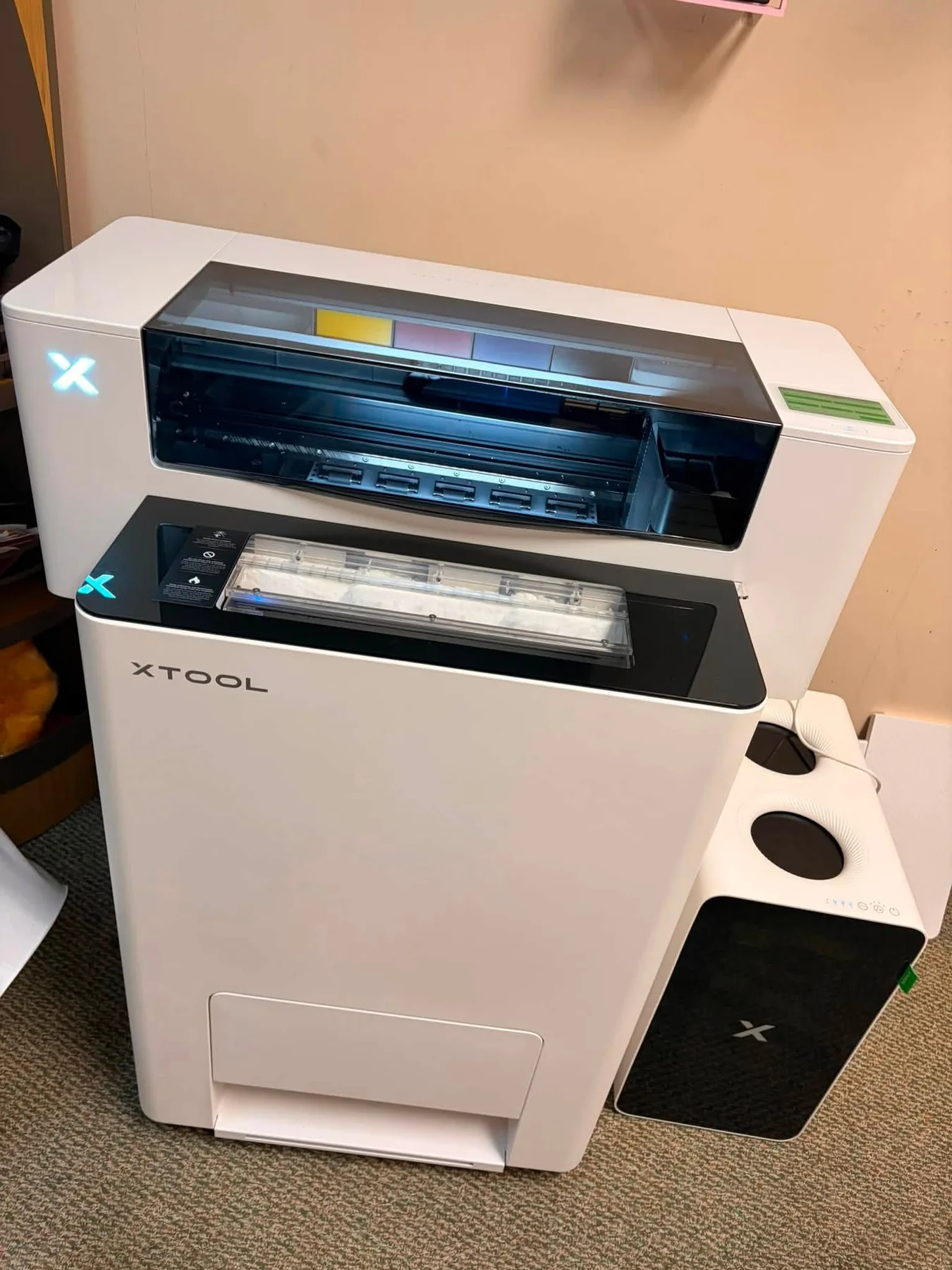Apparel printing equipment used in the shop for custom apparel production.